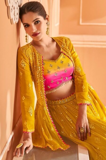Vibrant yellow lehenga with pink accents choli