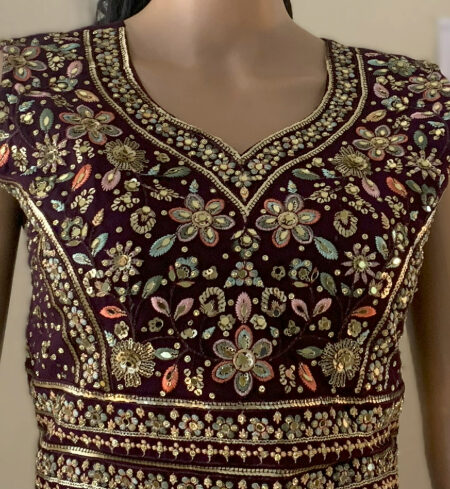 Rich dark purple color and gold embroidery lehanga
