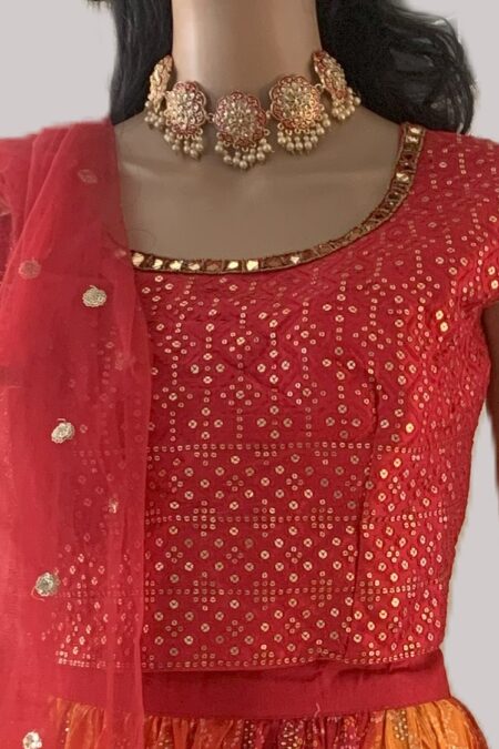 Red and orange hues with golden embellishment lehenga