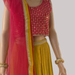 Deep pink choli and a bright yellow lehenga skirt