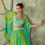 Blend green lehenga choli and dupatta with yellow accents