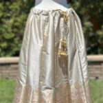 Cream Color skirt with matching Pink color Noodle strap Blouse/Choli