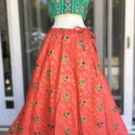Orange color skirt (Flower pattern design) with matching Teal color sleeveless Blouse/Choli